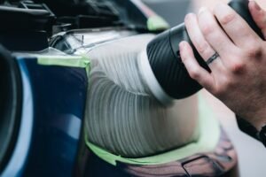 Polishing a car headlight during restoration