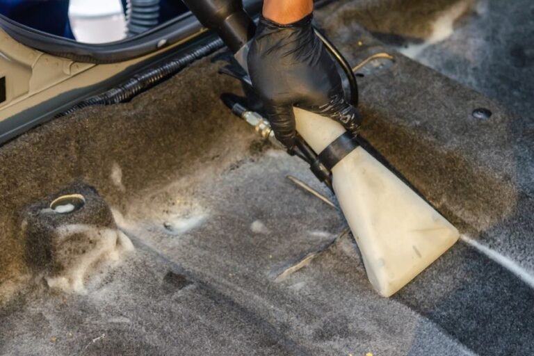 Extractor deep cleaning a car carpet