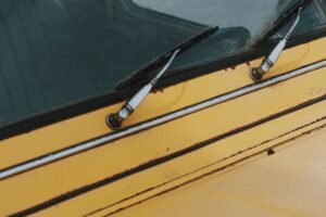 Windshield wipers on a yellow car